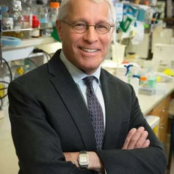 Dr. Owen Witte, posing in a laboratory.
