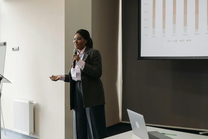 Woman with microphone public speaking