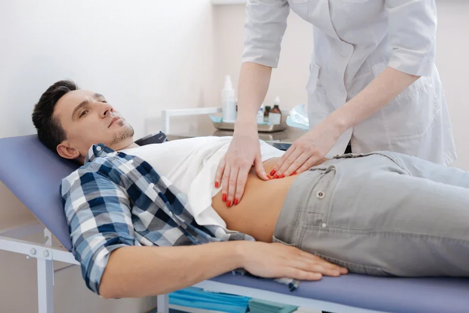 Gastroparesis Causes Young Man Receiving Abdominal Exam