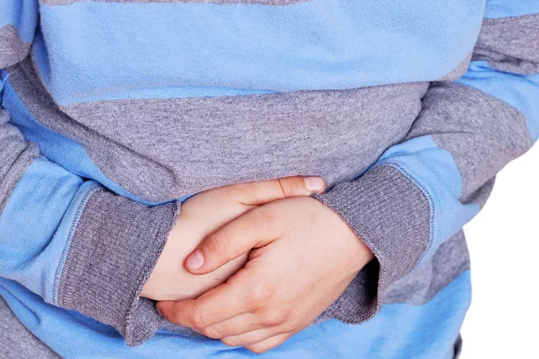 Gastroparesis Symptoms Person Clutching Stomach in Pain