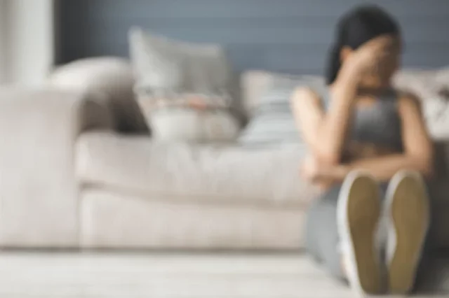 Disordered Eating Misconceptions Woman Sitting on Floor Feeling Shame