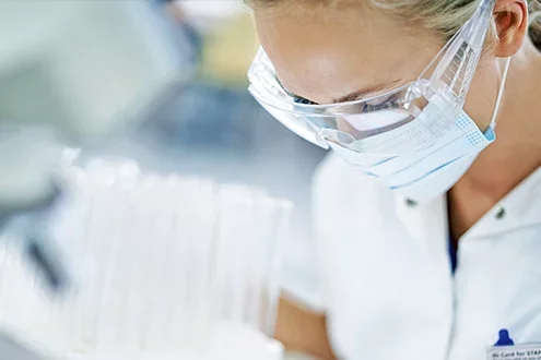 Kidney transplant surgeon wearing a protective mask